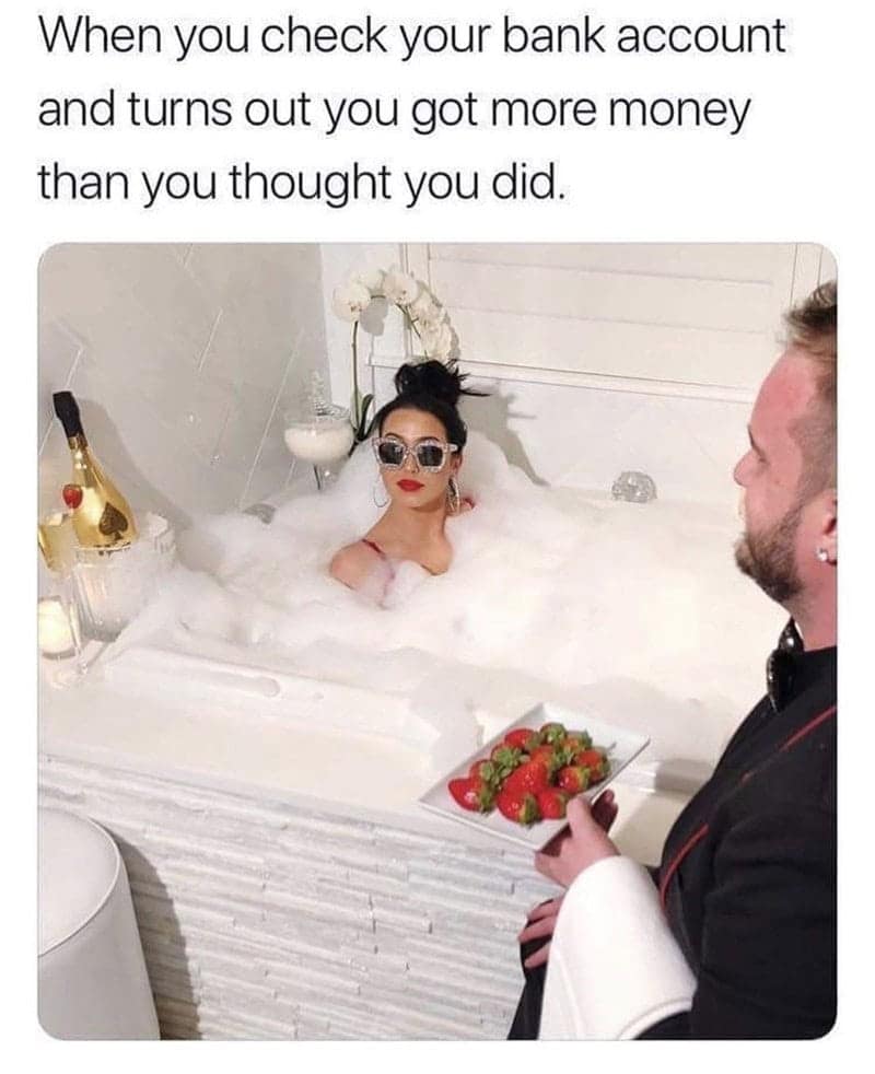 A funny self care meme showing a woman in a bubble bath, representing the feeling of having more money than you thought.