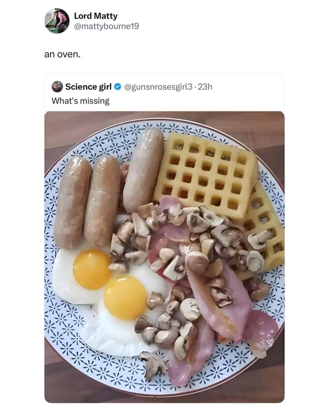 A funny British tweet and British meme roasting a sad-looking "Full English" breakfast, with the reply "an oven."