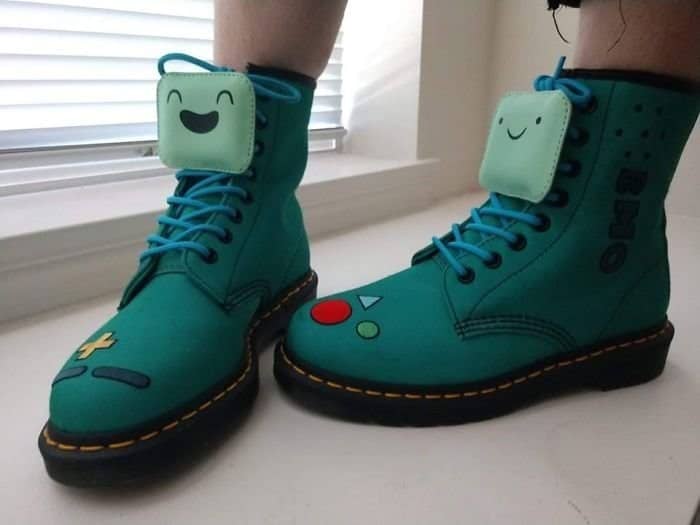 Teal Dr. Martens boots customized to look like BMO from Adventure Time.