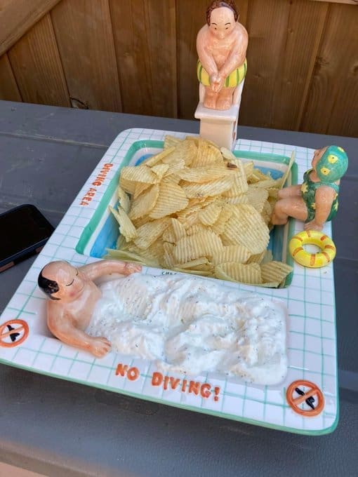 Ceramic chip and dip set shaped like a swimming pool with chubby swimmers.