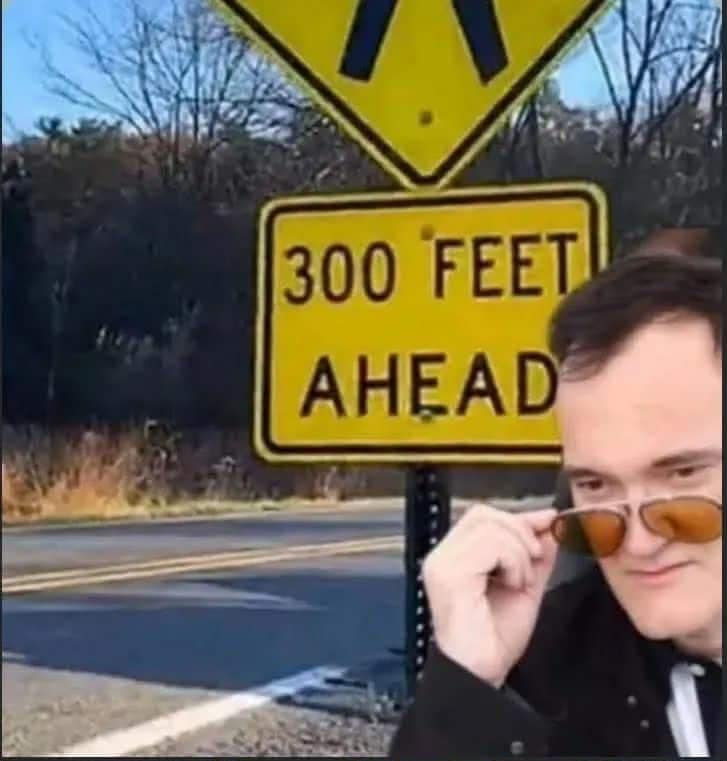 Classic meme of Quentin Tarantino reacting excitedly to a "Feet Ahead" sign.