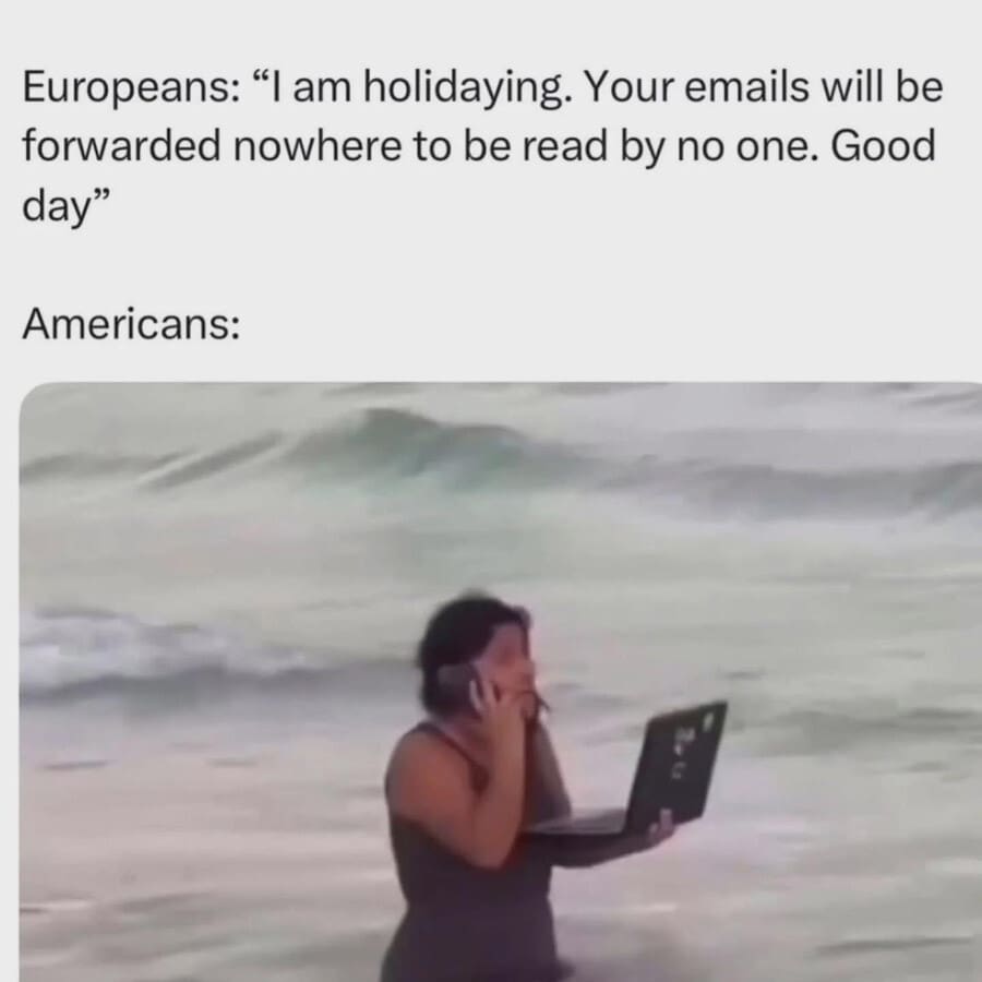 A classic meme comparing a "European" out-of-office message to an "American" (a woman with a laptop in the ocean).