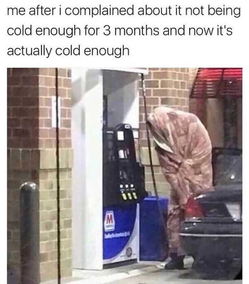 Relatable cold weather meme of a person bundled in a blanket pumping gas, regretting wishing for cold.