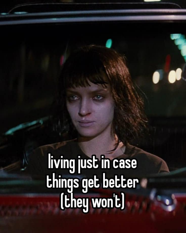 A depressing meme of a girl in a car, captioned "living just in case things get better (they won't)."