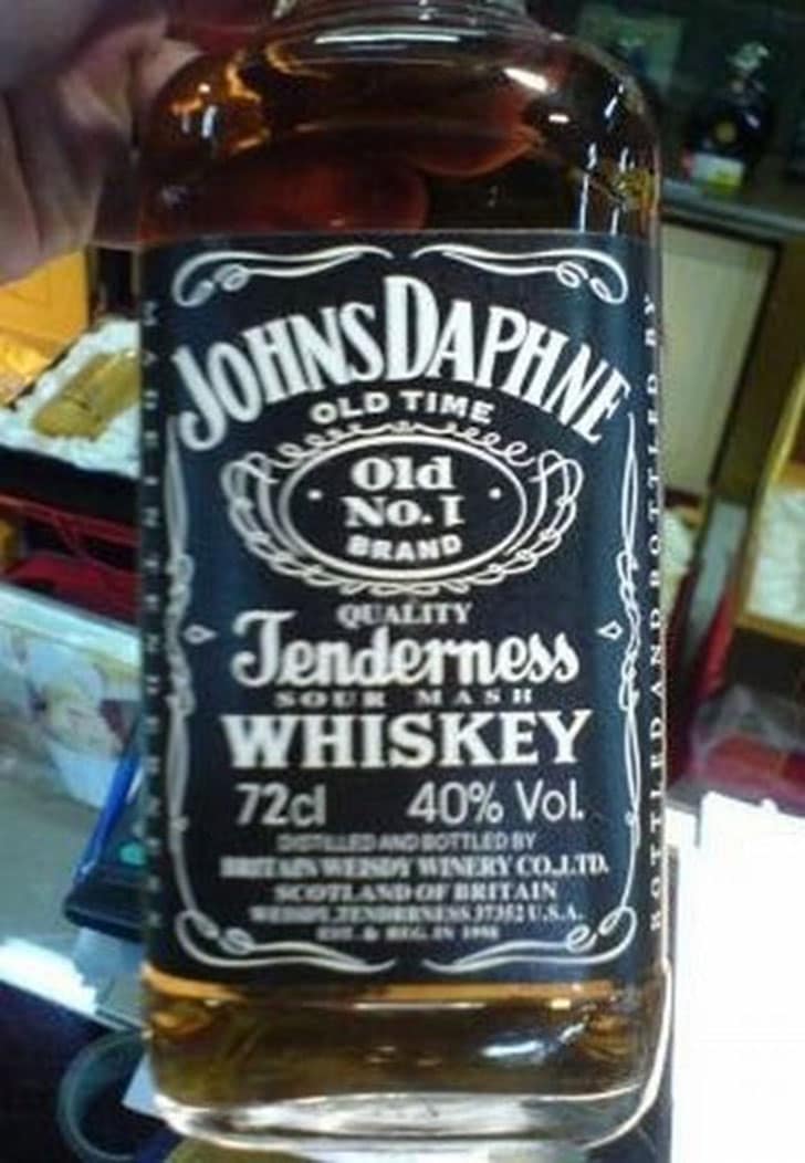 A funny knock off brand of Jack Daniel's whiskey, called "Johns Daphne" and "Tenderness."