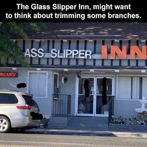 Tree branch blocking hotel sign to read Ass Slipper Inn funny memes.