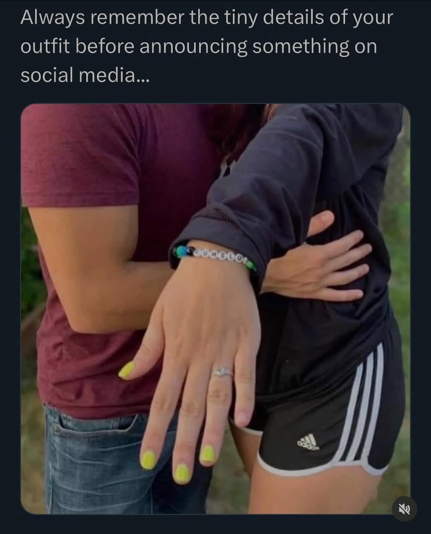Funny engagement photo fail where the woman's beaded bracelet accidentally spells out "a**hole" next to her ring.