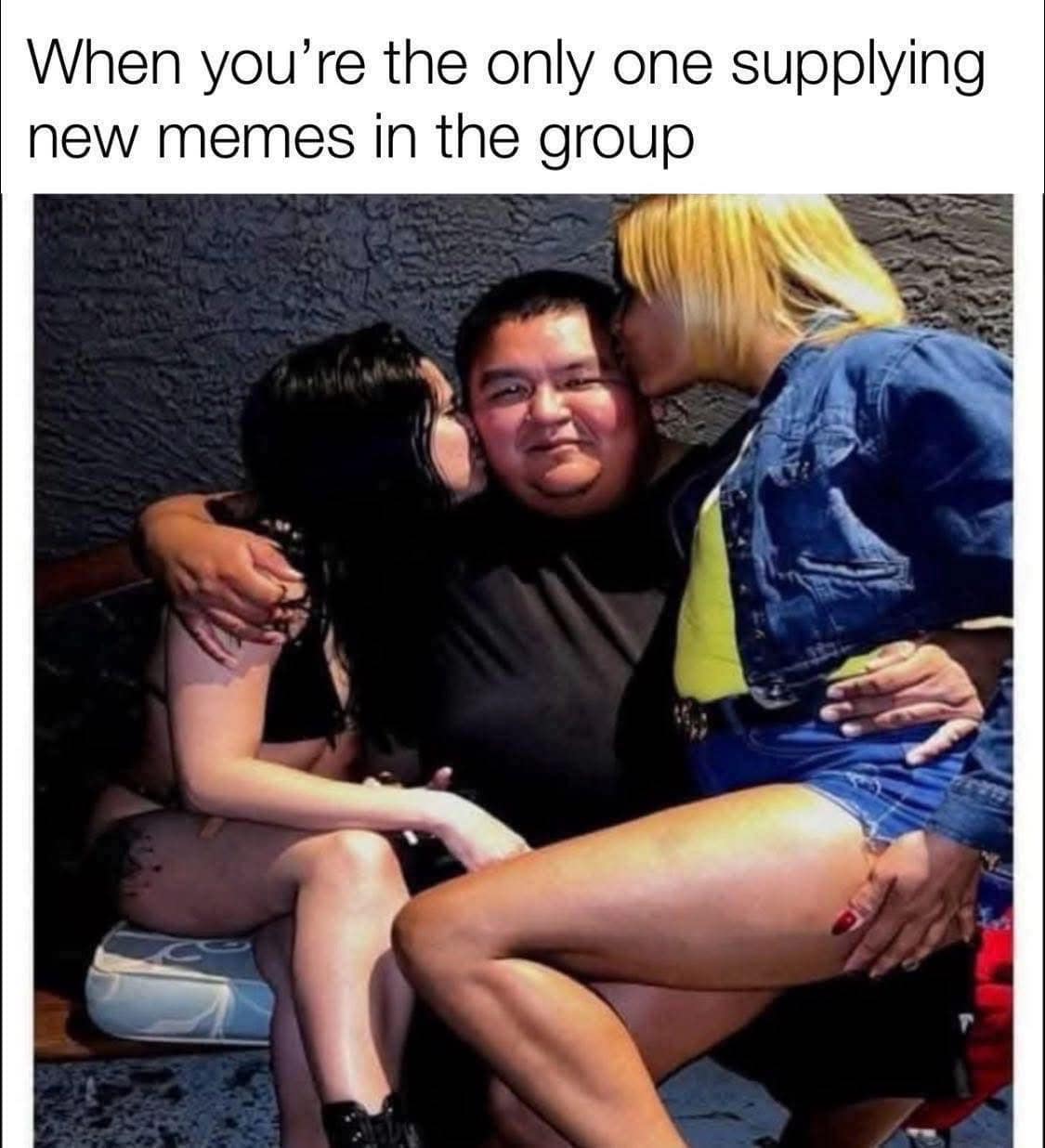 A funny meme of a man being kissed by two women, captioned "supplying new memes in the group."