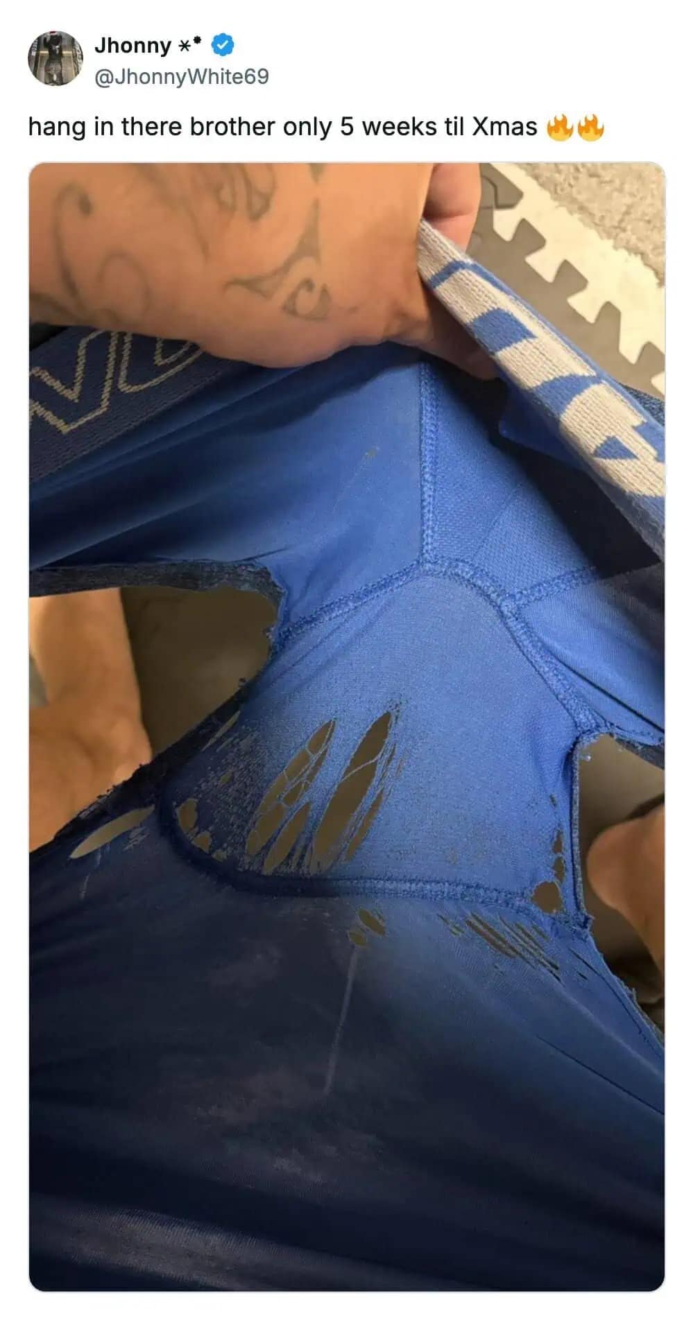 Tweet showing completely shredded blue boxer briefs waiting for Christmas replacement.