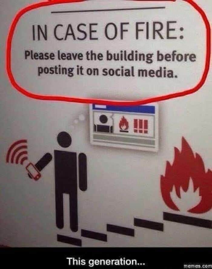 A funny sign about fire safety priorities instructing people to evacuate before posting online.