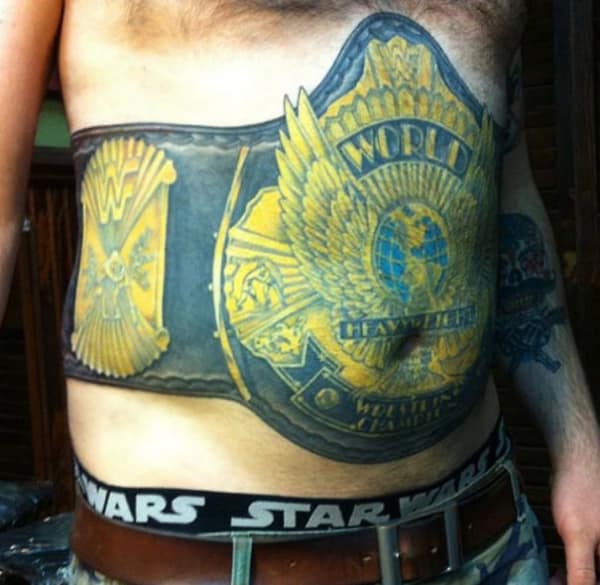 Massive World Heavyweight Wrestling Championship belt tattoo covering a man's entire stomach.
