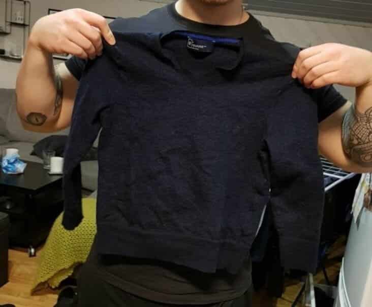 Laundry fail showing a sweater that shrunk to toddler size