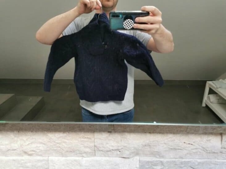 Laundry fail showing shredded clothes after a washing machine malfunction