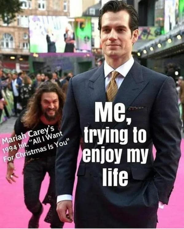 An "All i want for christmas is you meme" with Jason Momoa sneaking up on Henry Cavill.