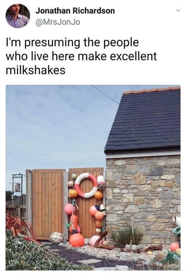 A funny meme and pun about a yard full of nautical "buoys," joking "I'm presuming the people who live here make excellent milkshakes."