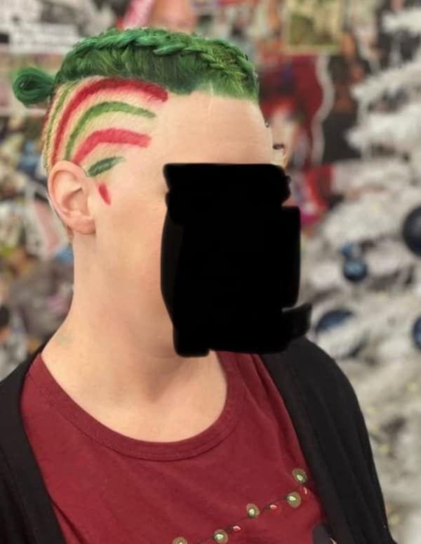 A festive but bad haircut with green braided hair and red/green stripes shaved on the side.