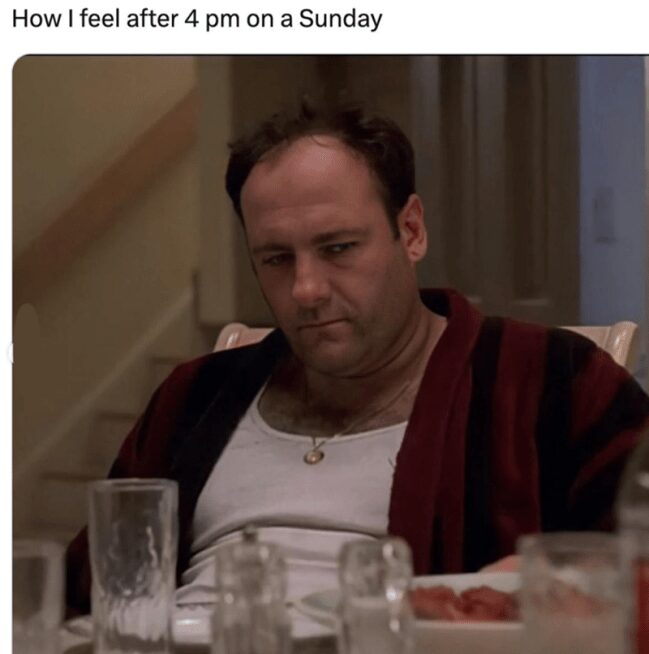 Tony Soprano looking depressed at the dinner table in a relatable Sunday meme.
