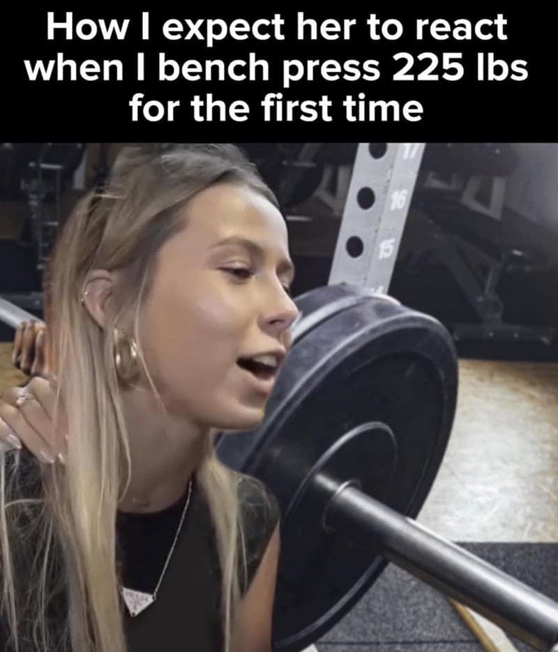 Workout meme showing a girl looking unimpressed while spotting a bench press