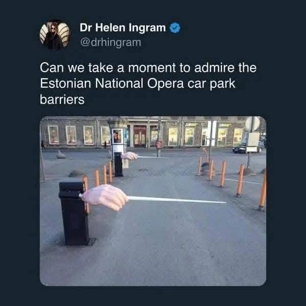 A viral tweet showing Estonian opera car park barriers shaped like conductor hands holding batons.
