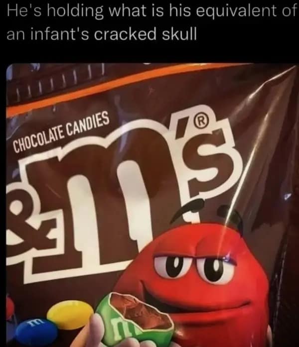 Red M&M character holding a broken chocolate candy with caption about skull.