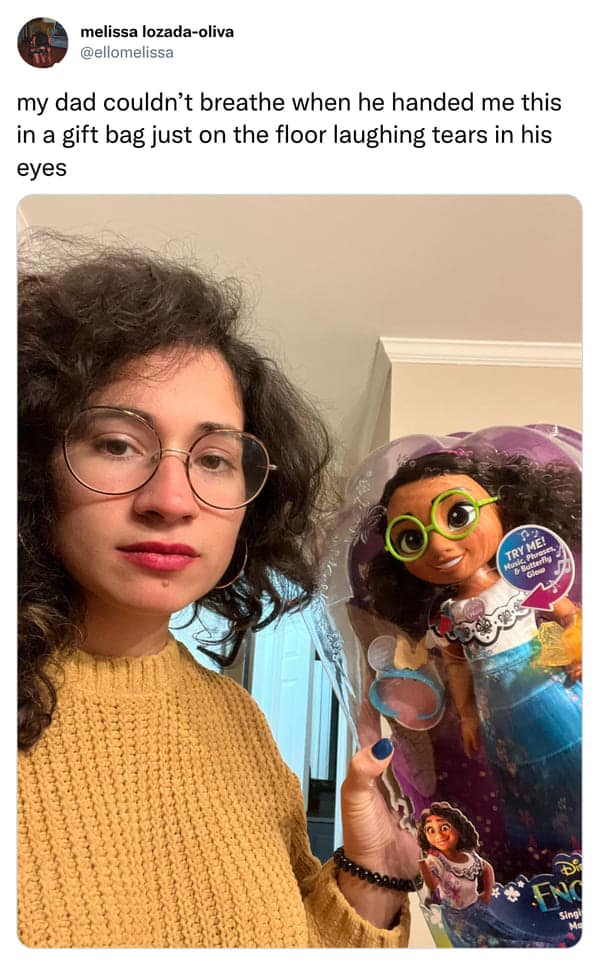 Woman holding Encanto doll that looks exactly like her funny pics.