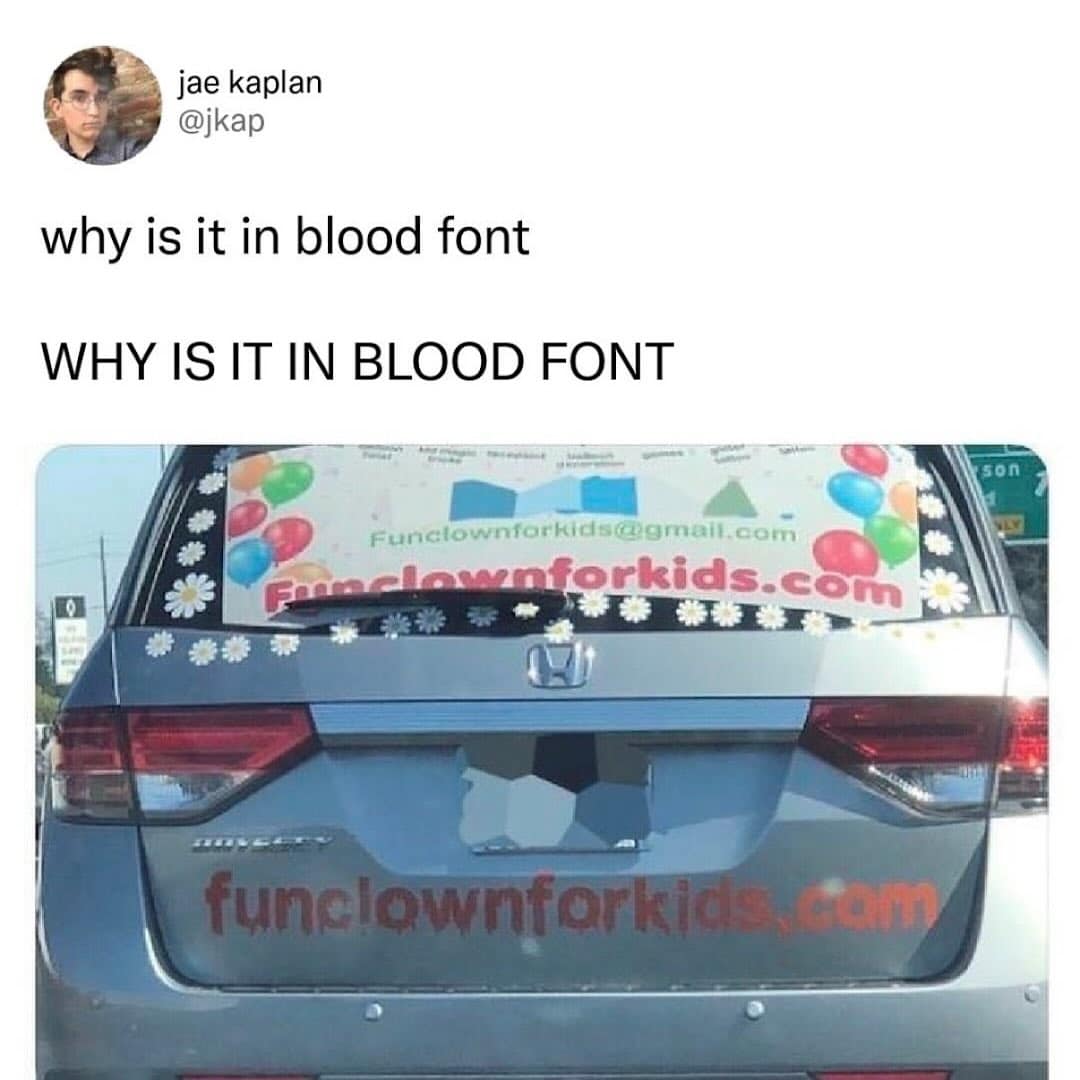 A car with a clown service advertisement written in a scary dripping blood font.