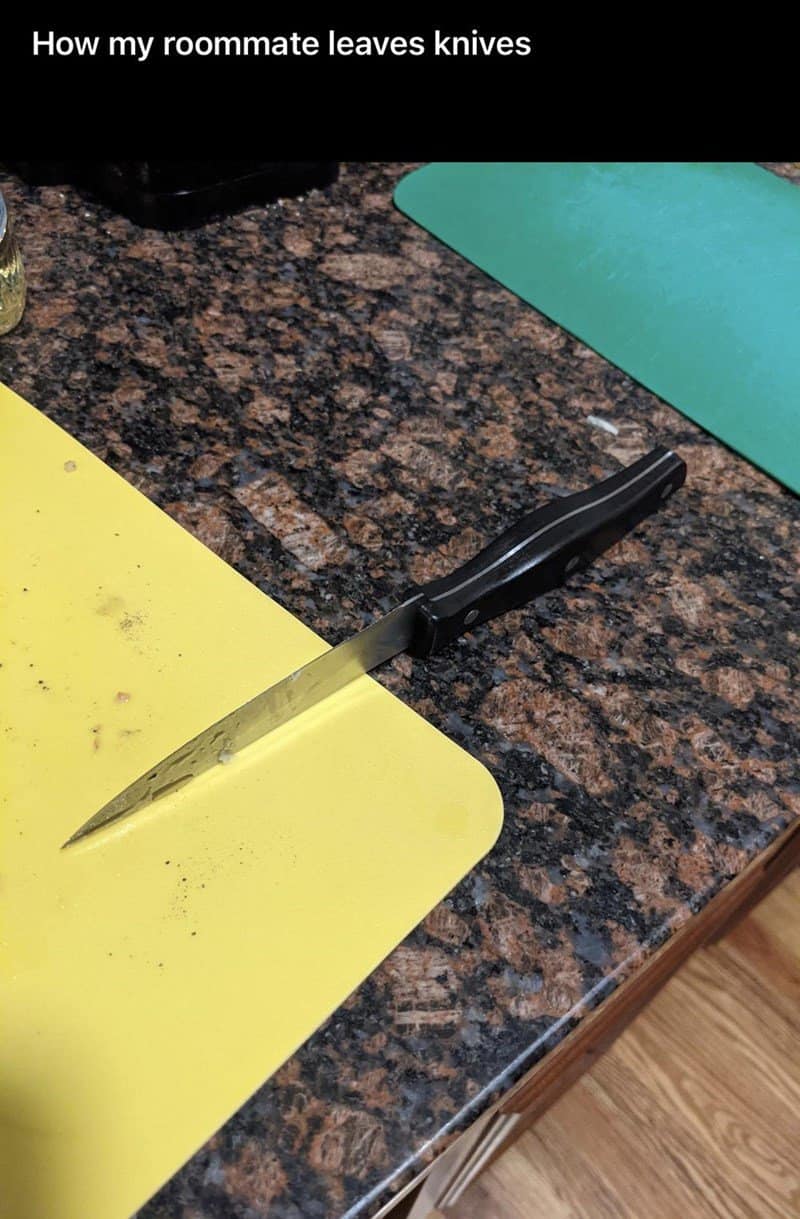 Sharp kitchen knife left balancing precariously on the edge of a counter.