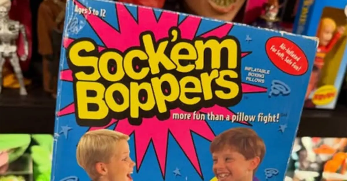 Collection of 90s toy classics and retro toys including a Furby, Pokémon Red, and Jurassic Park figures