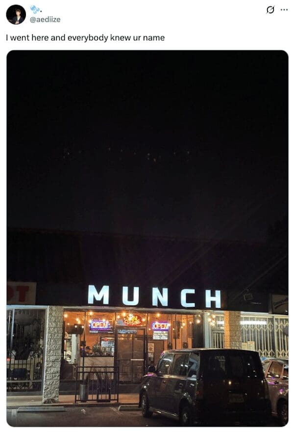 Brightly lit storefront sign reading Munch at night with a viral caption.