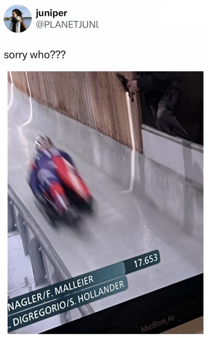 A relatable Milan Olympics 2026 memes reaction showing a completely blurred screenshot of a luge sled flying by the camera at impossible speeds, captioned "sorry who???" to perfectly capture the confusion of trying to watch the intensely fast sliding events.