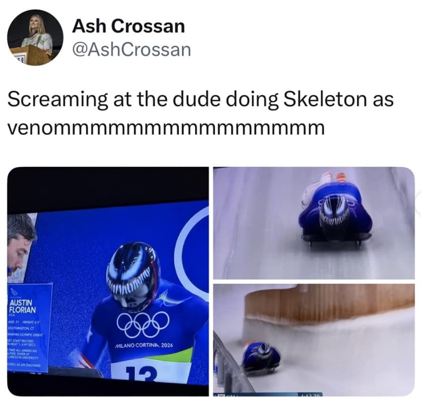 An awesome pop culture Milan Olympics 2026 memes post showing a Team USA skeleton athlete speeding down the icy track face-first while wearing an intimidating, custom-painted helmet that looks exactly like the Marvel character Venom.