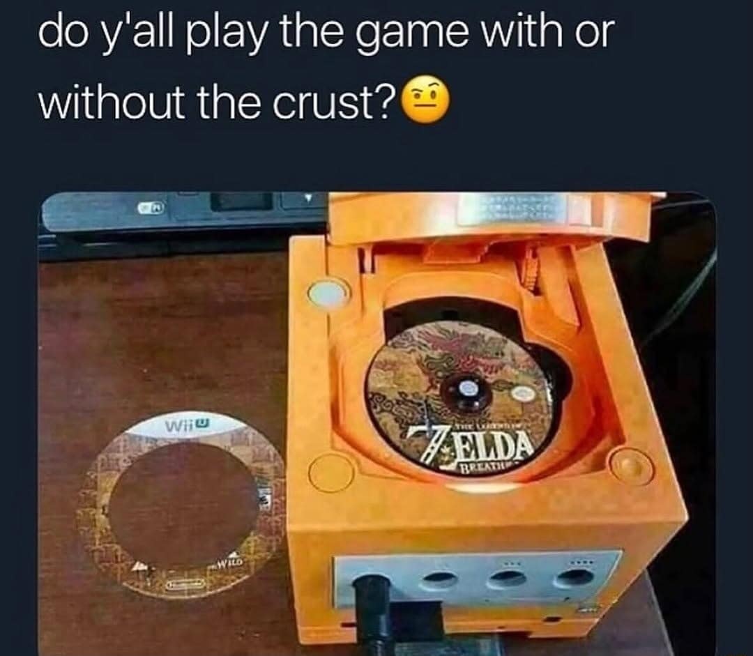 Zelda game disc cut to fit a Nintendo GameCube with the outer ring removed. Classic meme joking about eating game crust.