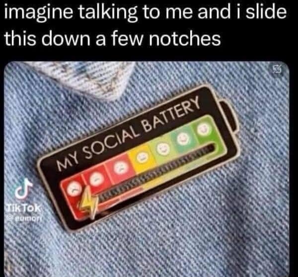 A hilariously petty social anxiety vintage meme showing a physical enamel pin of a sliding "Social Battery" meter, with the user threatening to aggressively slide the notch down into the red zone right in the middle of a boring conversation.