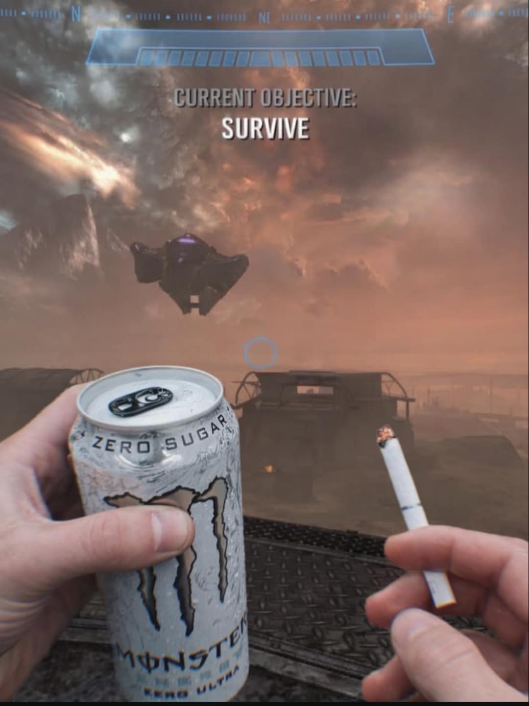 The ultimate gamer burnout old meme showing the devastating Halo: Reach "CURRENT OBJECTIVE: SURVIVE" screen, brilliantly photoshopped with hands holding a lit cigarette and a white Monster Zero Sugar energy drink.