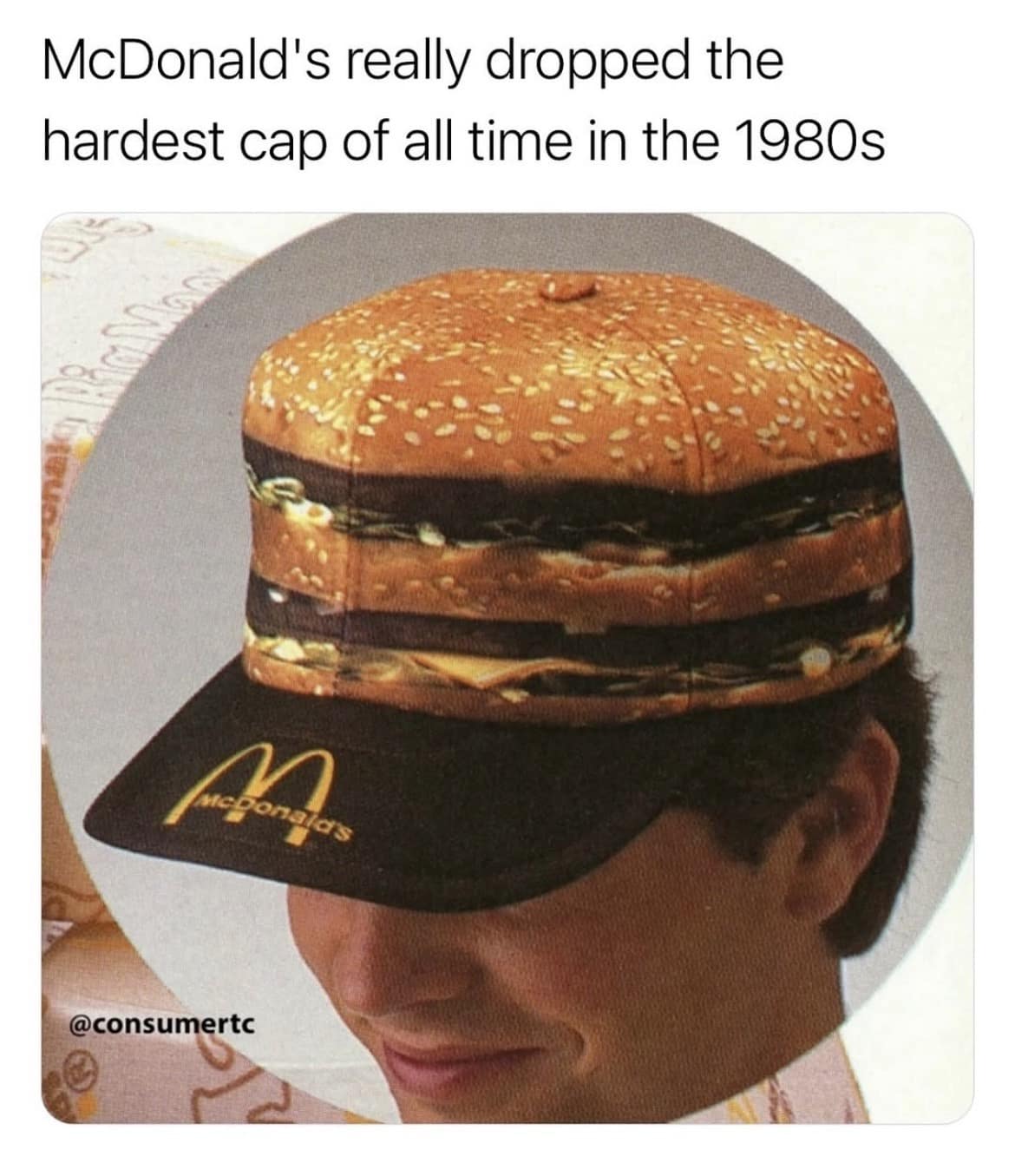 A nostalgic fashion old meme showing a vintage 1980s McDonald's uniform hat that is literally shaped and printed to look exactly like a giant, photorealistic hamburger resting on a worker's head.