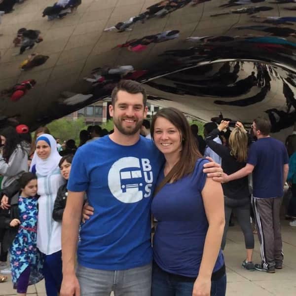 Couple at Millennium Park where the woman's hand on the man's shoulder looks like his own.
