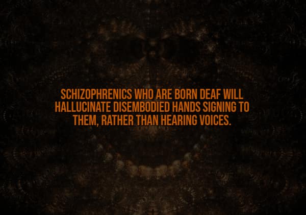A terrifying creepy fact overlaid on a dark, shadowy face reveals that individuals with schizophrenia who are born deaf experience hallucinations of disembodied hands signing to them instead of hearing phantom voices.