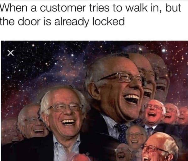 A cosmic-level customer service meme featuring multiple transparent layers of Bernie Sanders laughing hysterically against a starry galaxy, representing the pure, unfiltered, euphoric joy retail workers feel "When a customer tries to walk in, but the door is already locked".