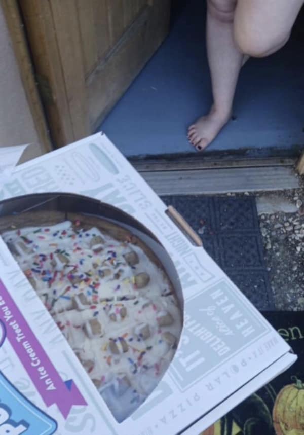 A door dash meme showing a delivery of a dessert pizza placed right next to the customer's bare foot in the doorway.