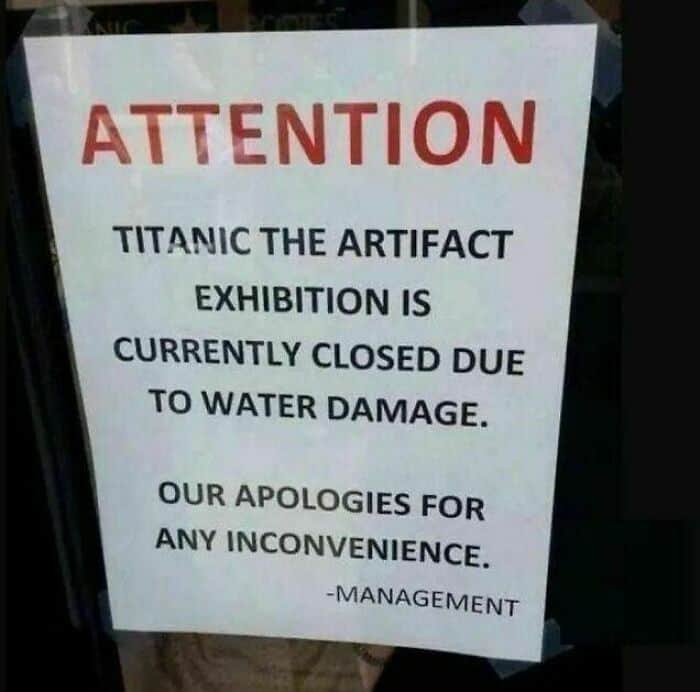 Public notice apologizing that the Titanic Artifact Exhibition is closed specifically due to water damage.