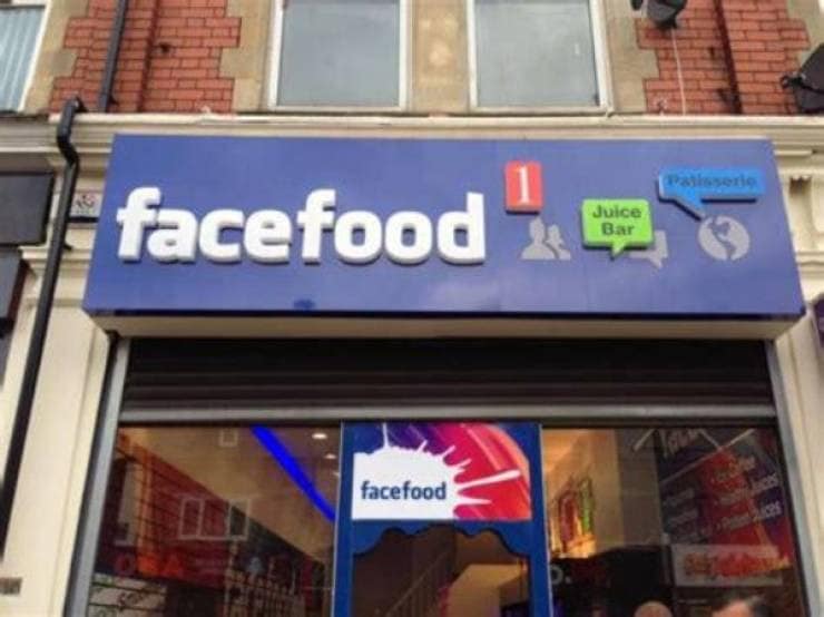 Storefront sign reading facefood using the exact blue and white branding of Facebook. Hilarious bootleg retail branding.