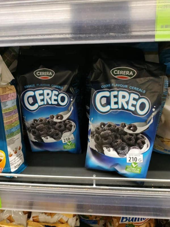 Bags of Cerera Cereo chocolate rings in blue packaging designed to look exactly like Oreo cereal on a grocery shelf.