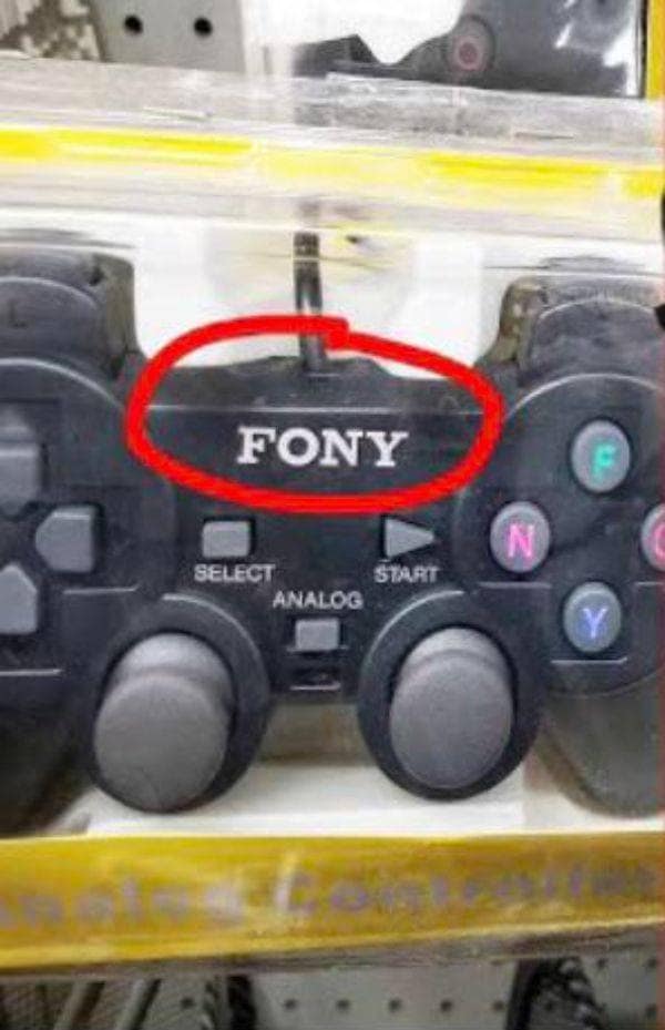 Black video game controller packaged in plastic with a bright red circle highlighting the brand name Fony instead of Sony.