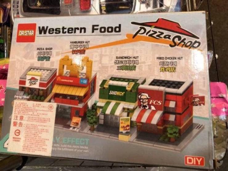 Fake Lego city set labeled Western Food featuring bootleg fast food restaurants like FCS instead of KFC and a Pizza Shop.