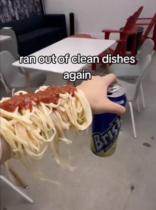 Viral funny meme showing spaghetti and tomato sauce draped over a person's arm due to no dishes.