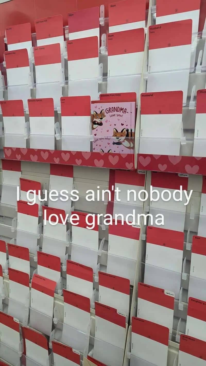 Humorous photo of a nearly empty greeting card aisle with one lonely Grandma card remaining.