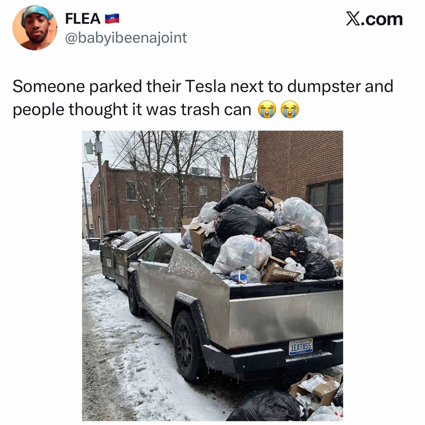Tesla Cybertruck parked by dumpsters covered in trash bags because people mistook it for a bin.