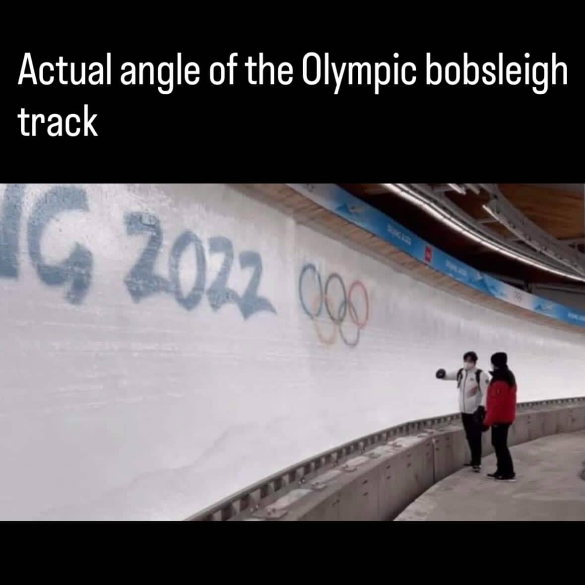 Vertical perspective of an Olympic bobsleigh track showing the extreme 90-degree angle of the ice wall.