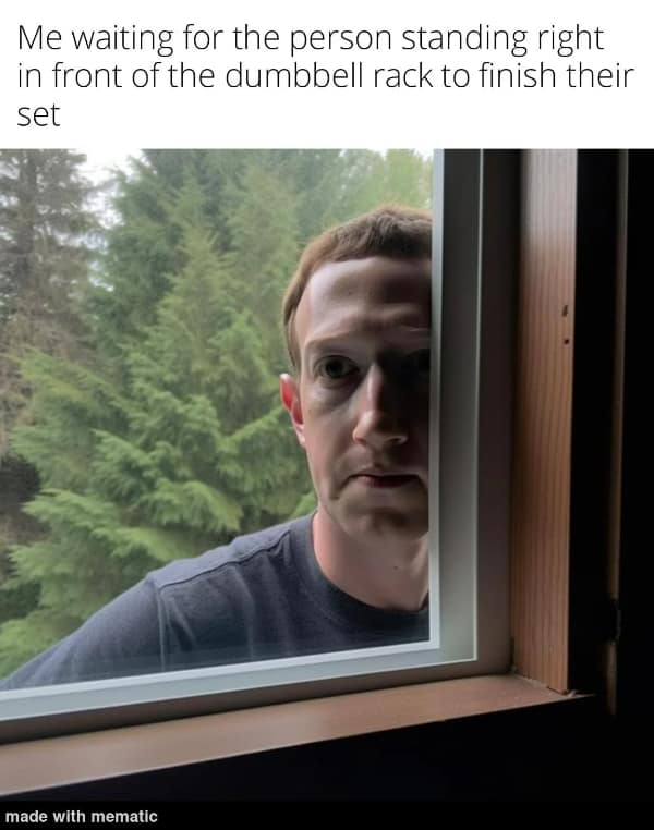A workout meme using Mark Zuckerberg staring through a window to illustrate the awkwardness of waiting for someone blocking the dumbbell rack.