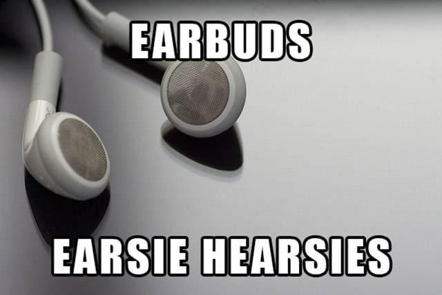 A pair of white wired earbuds with a text overlay suggesting "Earsie Hearsies."